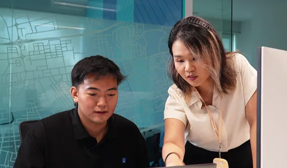 Employees talking over screen